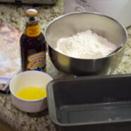 Flour, brown sugar, baking powder and salt in bowl. Beer, butter and pan.