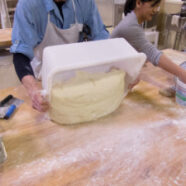 Flipping the dough onto the table to divide and shape