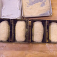 Seeded semolina loaves in loaf pans